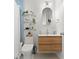 Stylish bathroom featuring a modern vanity, updated fixtures, and decorative shelving, and a tiled floor at 1003 W Indiana Ave, Tampa, FL 33603