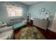 Charming Bedroom with dinosaur decor, crib, and changing table at 1003 W Indiana Ave, Tampa, FL 33603