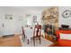 Dining room with stone fireplace, table, and natural light at 1003 W Indiana Ave, Tampa, FL 33603