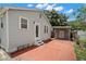Charming home with a brick paved area and a detached garage, showing great curb appeal at 1003 W Indiana Ave, Tampa, FL 33603