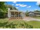 Charming exterior with landscaped yard and covered porch area at 1003 W Indiana Ave, Tampa, FL 33603
