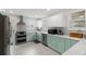 Well-equipped kitchen with modern appliances and stylish countertops at 1003 W Indiana Ave, Tampa, FL 33603
