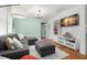 Cozy living room with hardwood floors and ample natural light at 1003 W Indiana Ave, Tampa, FL 33603