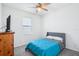 Cozy bedroom with ceiling fan, closet and bright window at 10111 Tuscan Sun Ave, Riverview, FL 33578