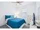 Bedroom with ceiling fan, window, plush carpet, and dresser at 10111 Tuscan Sun Ave, Riverview, FL 33578