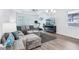 Cozy living room featuring a modern design, large sectional couch, and a large TV at 10111 Tuscan Sun Ave, Riverview, FL 33578