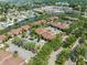 Community aerial view of condos, water features, lush trees and parking at 10511 Waterview Ct # 10511, Tampa, FL 33615