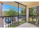 Screened balcony offers outdoor space overlooking the parking and landscaping at 10511 Waterview Ct # 10511, Tampa, FL 33615