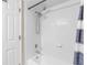 Clean bathroom with tiled shower and white door at 10511 Waterview Ct # 10511, Tampa, FL 33615
