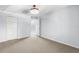Bedroom view showcasing neutral carpet, white walls, and a closet, creating a simple, clean space at 10511 Waterview Ct # 10511, Tampa, FL 33615