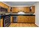 Updated kitchen features granite counters, stainless appliances, and wood cabinets at 10511 Waterview Ct # 10511, Tampa, FL 33615