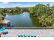 A beautiful lake view featuring a dock with a tiki hut and a lounge area at 10511 Waterview Ct # 10511, Tampa, FL 33615