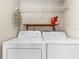 Washer and dryer hookups with overhead rack for storage in laundry room at 10511 Waterview Ct # 10511, Tampa, FL 33615
