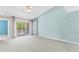 Bright living room with ceiling fan and sliding door to screened balcony at 10511 Waterview Ct # 10511, Tampa, FL 33615