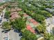 Aerial view of tennis courts in the community, lush trees surround the courts at 10511 Waterview Ct # 10511, Tampa, FL 33615