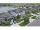 Stunning aerial view of a home, showcasing landscaping and community lake at 11684 Brighton Knoll Loop, Riverview, FL 33579