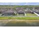 View of backyard featuring green lawn, enclosed patio and landscaping at 11684 Brighton Knoll Loop, Riverview, FL 33579