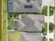 Backyard with enclosed patio area, lush landscaping and fencing at 11684 Brighton Knoll Loop, Riverview, FL 33579