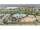 An aerial view shows the pool, playground, and surrounding homes in this well-maintained community and neighborhood at 11684 Brighton Knoll Loop, Riverview, FL 33579