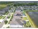 Neighborhood aerial view with water and green spaces around the homes at 11684 Brighton Knoll Loop, Riverview, FL 33579