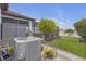Landscaped backyard featuring a view of a lake and neighboring homes at 11684 Brighton Knoll Loop, Riverview, FL 33579