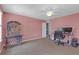 Well-lit bedroom with a desk area, offering a functional and comfortable space at 11684 Brighton Knoll Loop, Riverview, FL 33579