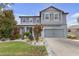 Charming two-story home featuring a landscaped front yard and neutral gray exterior at 11684 Brighton Knoll Loop, Riverview, FL 33579