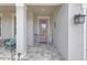 Inviting front porch featuring neutral decor and tiled flooring at 11684 Brighton Knoll Loop, Riverview, FL 33579