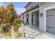 Inviting front porch with stone pavers, decorative plants, and charming curb appeal at 11684 Brighton Knoll Loop, Riverview, FL 33579