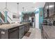 Modern kitchen with an island, stainless steel appliances, and granite countertops at 11684 Brighton Knoll Loop, Riverview, FL 33579
