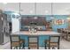 Spacious kitchen featuring granite countertops, a large island with breakfast bar seating and stainless appliances at 11684 Brighton Knoll Loop, Riverview, FL 33579