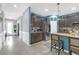 Bright kitchen featuring a large island with breakfast bar seating, and stainless steel appliances at 11684 Brighton Knoll Loop, Riverview, FL 33579