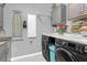 Functional laundry room with washer, dryer, and ample cabinet space at 11684 Brighton Knoll Loop, Riverview, FL 33579