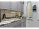 Practical laundry room with a utility sink and cabinets at 11684 Brighton Knoll Loop, Riverview, FL 33579