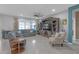 Spacious living room featuring a gray sectional sofa, patterned armchair, and large entertainment center at 11684 Brighton Knoll Loop, Riverview, FL 33579