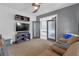Comfortable living room featuring a ceiling fan and access to another room at 11684 Brighton Knoll Loop, Riverview, FL 33579