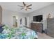 Bright primary bedroom featuring a ceiling fan and ensuite bathroom at 11684 Brighton Knoll Loop, Riverview, FL 33579