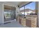 Outdoor kitchen equipped with a built-in grill and stone counter, perfect for entertaining at 11684 Brighton Knoll Loop, Riverview, FL 33579