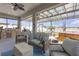 Inviting screened-in patio with comfortable seating, hot tub, and outdoor grill at 11684 Brighton Knoll Loop, Riverview, FL 33579