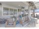 Relaxing outdoor space with wicker furniture, television, and screened enclosure at 11684 Brighton Knoll Loop, Riverview, FL 33579