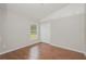 Bright bedroom featuring hardwood floors, vaulted ceiling, and closet at 11741 Teapot Ct, Spring Hill, FL 34609