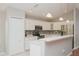 Modern kitchen featuring white cabinetry, stainless steel appliances, and an island at 11741 Teapot Ct, Spring Hill, FL 34609