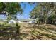 Spacious backyard with tree, swing set, firepit, patio and a shed at 12019 106Th Ct, Largo, FL 33778