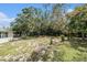 Backyard with a swing set, firepit area, and a shed at 12019 106Th Ct, Largo, FL 33778