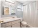 Classic bathroom with tile countertop, vanity, toilet, and shower with curtain at 12019 106Th Ct, Largo, FL 33778