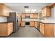 Modern kitchen with stainless steel appliances and wooden cabinetry at 12019 106Th Ct, Largo, FL 33778