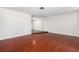 Spacious living room with hardwood floors, bright walls, and neutral trim at 12019 106Th Ct, Largo, FL 33778