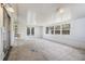 Bright sunroom featuring white walls, a ceiling fan, windows, and French doors leading to the backyard at 12019 106Th Ct, Largo, FL 33778