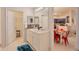 Spacious bathroom with double sinks, decorative backsplash, and modern lighting at 1230 S Missouri Ave # 704, Clearwater, FL 33756