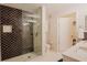 Modern bathroom with glass shower enclosure and updated tiling at 1230 S Missouri Ave # 704, Clearwater, FL 33756